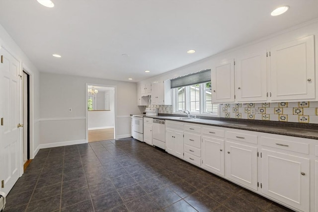 kitchen featuring electric stove, dark countertops, dishwashing machine, white cabinets, and recessed lighting