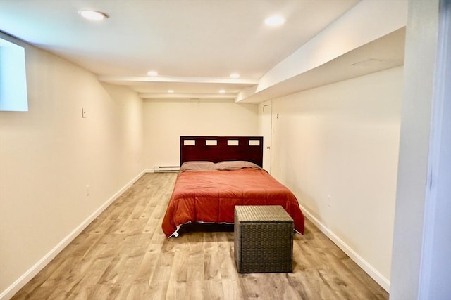 bedroom with light wood-style floors, recessed lighting, a baseboard radiator, and baseboards