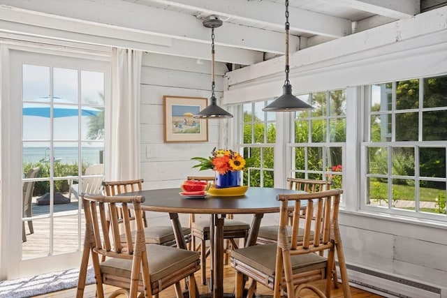 sunroom featuring a baseboard radiator