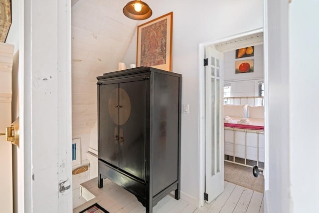 bathroom featuring vaulted ceiling