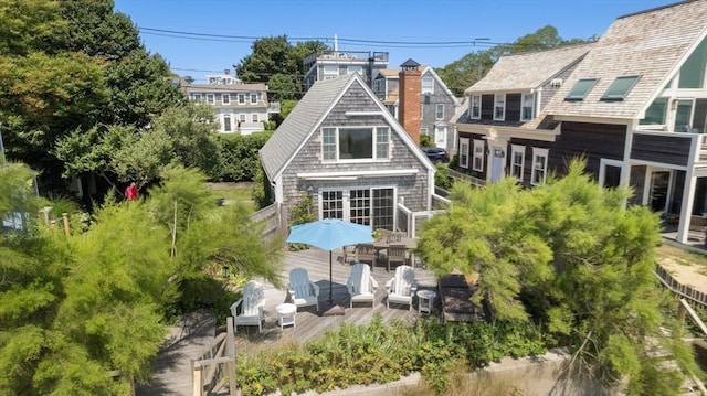 rear view of house featuring an outdoor hangout area and a deck