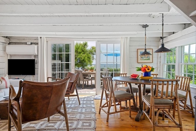 sunroom with wooden ceiling, beam ceiling, and a wealth of natural light