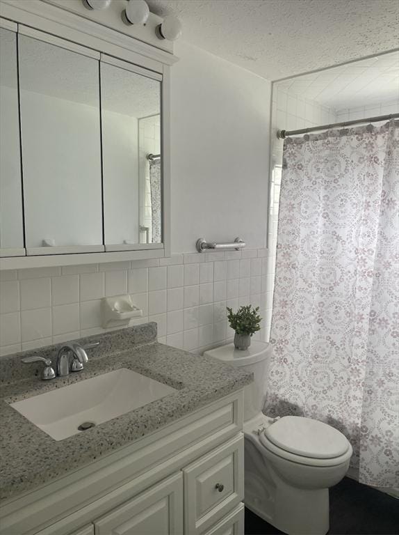 8 Zabriskie Unit 8B, Newburyport, MA 01950 - full bath with vanity, toilet, a shower with shower curtain, a textured ceiling, and tasteful backsplash
