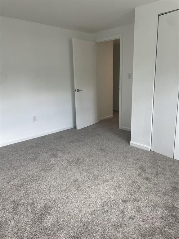 8 Zabriskie Unit 8B, Newburyport, MA 01950 - unfurnished bedroom with carpet flooring and baseboards