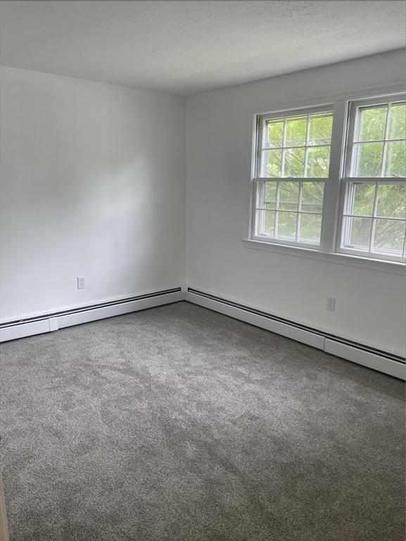 8 Zabriskie Unit 8B, Newburyport, MA 01950 - empty room featuring carpet flooring