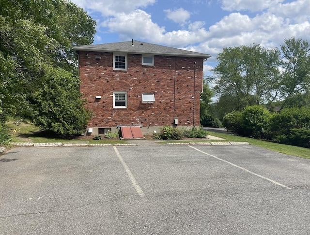 8 Zabriskie Unit 8B, Newburyport, MA 01950 - view of side of property featuring uncovered parking and brick siding