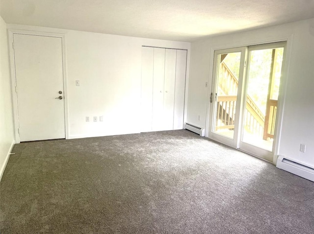 8 Zabriskie Unit 8B, Newburyport, MA 01950 - unfurnished bedroom featuring access to outside, multiple windows, carpet flooring, and a baseboard radiator