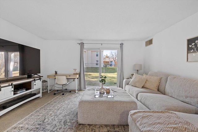 living room featuring light carpet