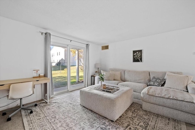 living room with light colored carpet