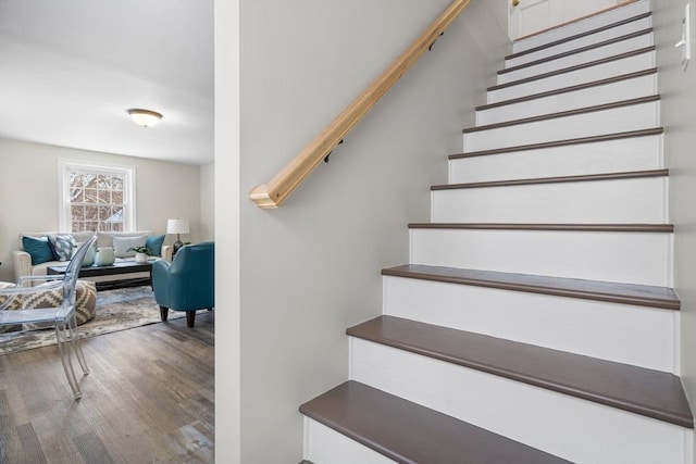 stairway featuring wood-type flooring