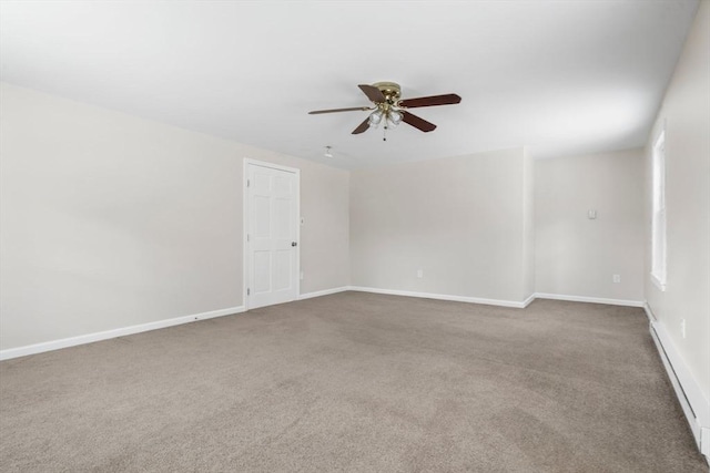 empty room featuring ceiling fan and carpet