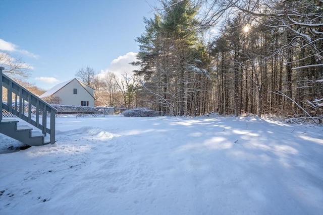 view of yard covered in snow