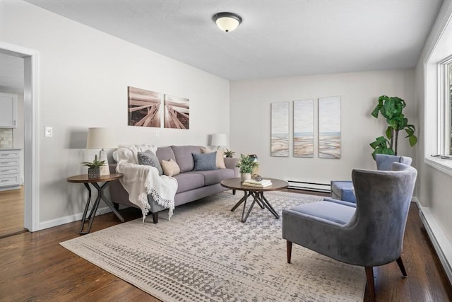 living room with dark wood-type flooring and a baseboard heating unit