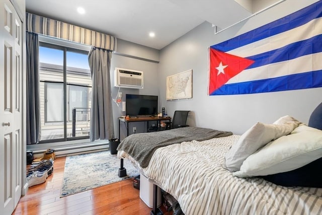 12 Stoneholm Unit 621, Boston, MA 02115 - bedroom with hardwood / wood-style flooring, a wall mounted AC, and recessed lighting