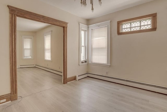 69 Metropolitan Ave, Boston, MA 02131 - unfurnished room with light wood-style flooring and a baseboard radiator