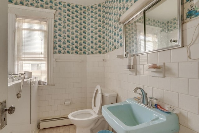 69 Metropolitan Ave, Boston, MA 02131 - bathroom featuring baseboard heating, tile walls, wallpapered walls, and wainscoting
