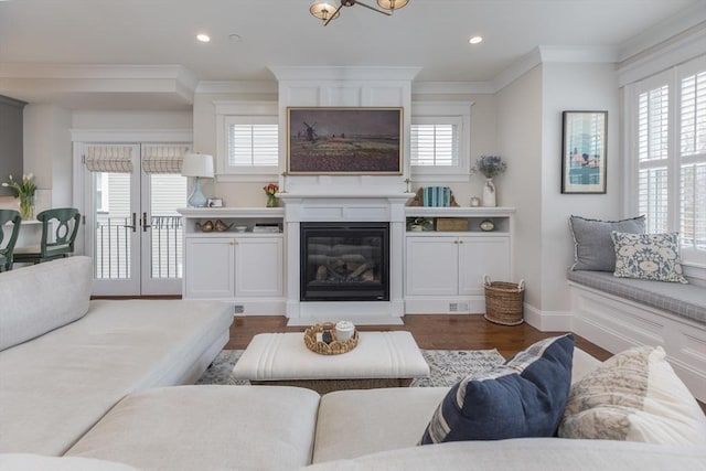 living area featuring crown molding, recessed lighting, and dark wood-style floors
