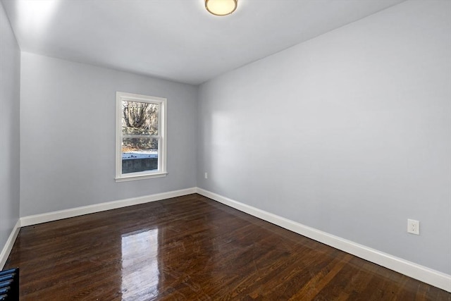 empty room featuring dark wood-type flooring