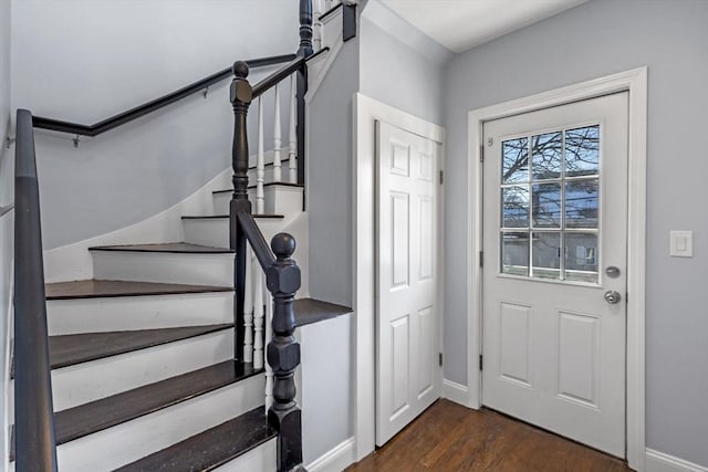 foyer entrance with dark hardwood / wood-style floors