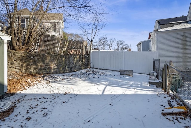 view of yard covered in snow