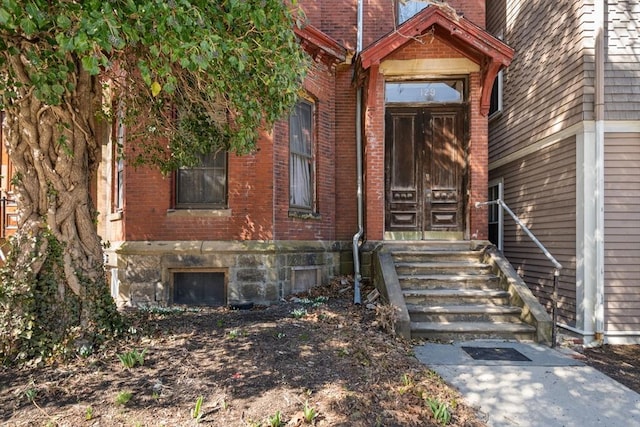 property entrance with brick siding
