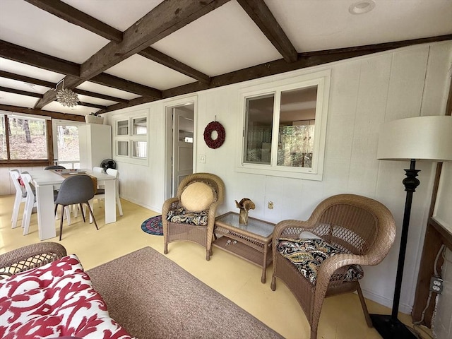 12 Cherry Rd, Goshen, MA 01032 - living room featuring beamed ceiling, coffered ceiling, a decorative wall, and a ceiling fan
