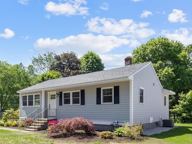 7 Grove St, Westford, MA 01886 - ranch-style home with a shingled roof, cooling unit, and a chimney