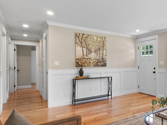 7 Grove St, Westford, MA 01886 - foyer featuring light wood-style flooring, ornamental molding, wainscoting, recessed lighting, and a decorative wall
