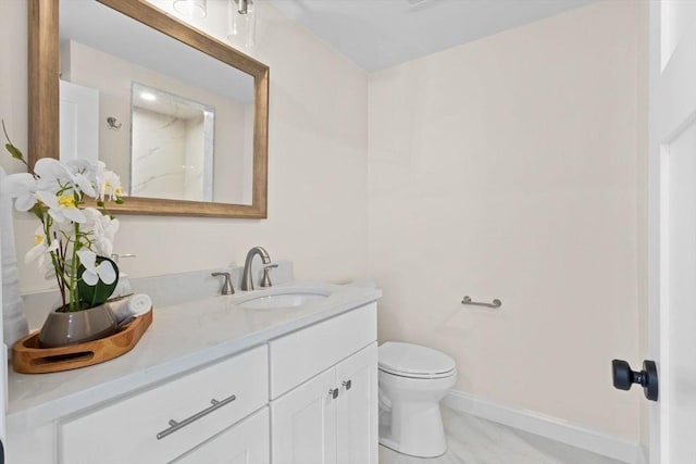 7 Grove St, Westford, MA 01886 - bathroom featuring vanity, toilet, and baseboards
