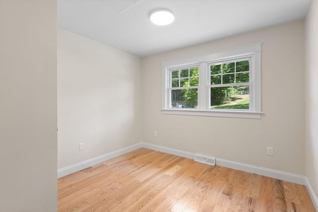 7 Grove St, Westford, MA 01886 - empty room with light wood-style floors and baseboards