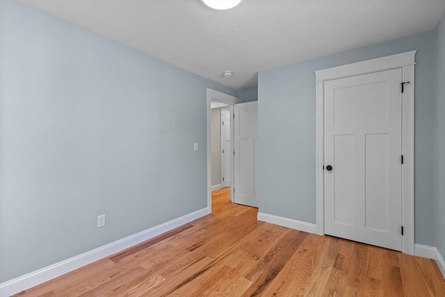 7 Grove St, Westford, MA 01886 - unfurnished bedroom featuring baseboards and light wood-style floors