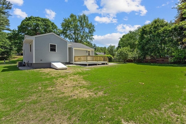 7 Grove St, Westford, MA 01886 - rear view of property featuring central AC unit, a deck, and view of scattered trees