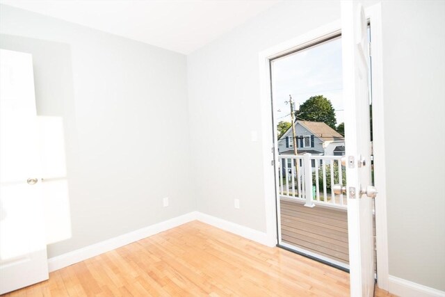29 Roanoke St, Lynn, MA 01904 - empty room with wood finished floors and baseboards