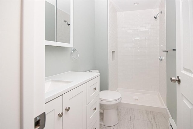 29 Roanoke St, Lynn, MA 01904 - bathroom featuring vanity, toilet, tiled shower, and marble look tiles