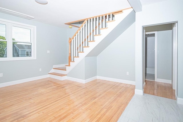 29 Roanoke St, Lynn, MA 01904 - staircase featuring baseboards and wood finished floors