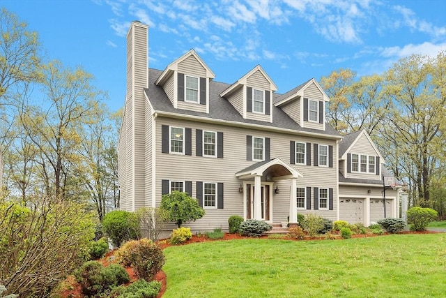 93 Towne Hill Rd, Haverhill, MA 01835 - view of front of home with a chimney, a garage, and a front lawn