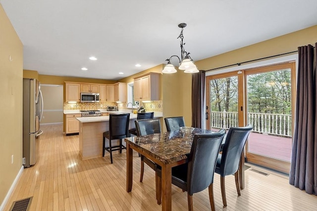 93 Towne Hill Rd, Haverhill, MA 01835 - dining area featuring light wood finished floors, baseboards, recessed lighting, and a chandelier