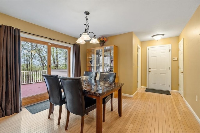 93 Towne Hill Rd, Haverhill, MA 01835 - dining space featuring light wood finished floors, baseboards, and a chandelier