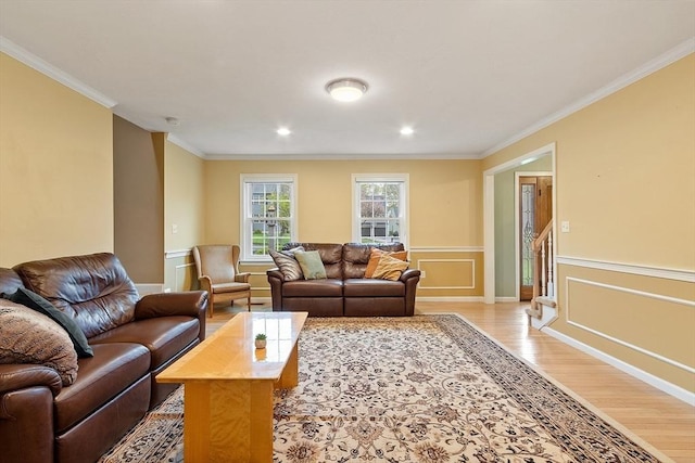 93 Towne Hill Rd, Haverhill, MA 01835 - living area with light wood-type flooring, crown molding, a wainscoted wall, and recessed lighting
