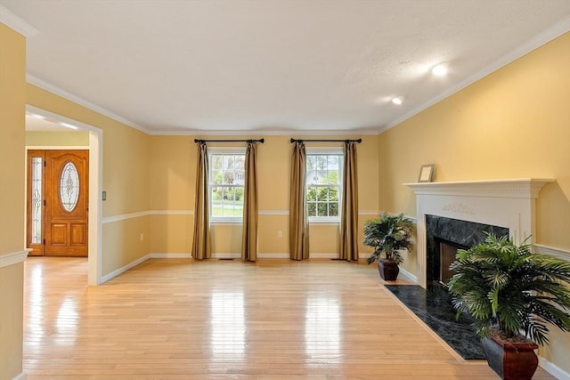 93 Towne Hill Rd, Haverhill, MA 01835 - living area featuring a high end fireplace, light wood-type flooring, baseboards, and crown molding