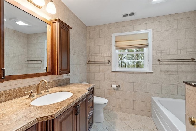93 Towne Hill Rd, Haverhill, MA 01835 - full bathroom with tile walls, toilet, vanity, and a bathtub