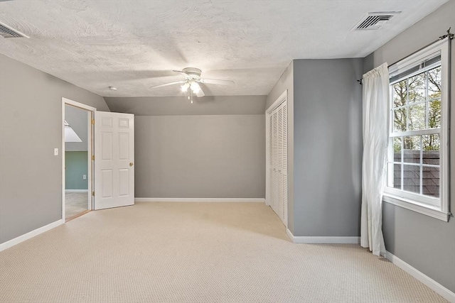 93 Towne Hill Rd, Haverhill, MA 01835 - unfurnished bedroom featuring light colored carpet, a closet, baseboards, a ceiling fan, and lofted ceiling