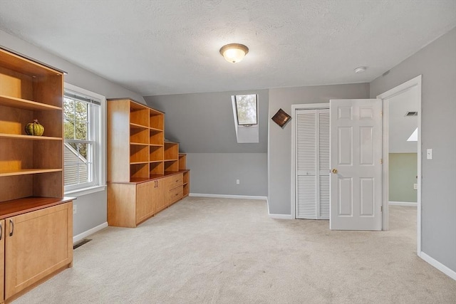 93 Towne Hill Rd, Haverhill, MA 01835 - additional living space featuring light colored carpet, baseboards, and a textured ceiling