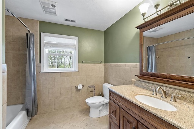 93 Towne Hill Rd, Haverhill, MA 01835 - bathroom with tile walls, tile patterned flooring, toilet, vanity, and shower / bath combo
