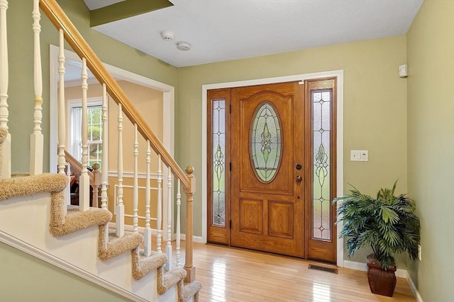 93 Towne Hill Rd, Haverhill, MA 01835 - entryway featuring stairs, light wood-style floors, and baseboards
