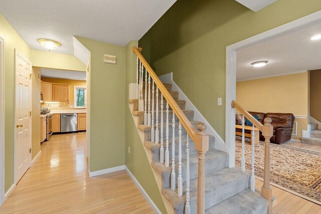 93 Towne Hill Rd, Haverhill, MA 01835 - stairway featuring wood-type flooring and baseboards