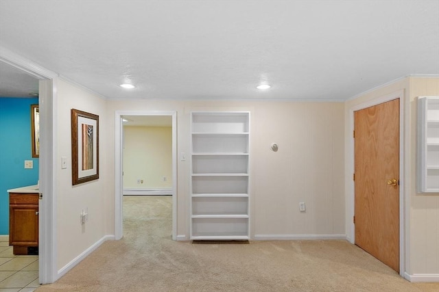 interior space with baseboards, built in features, light carpet, baseboard heating, and recessed lighting