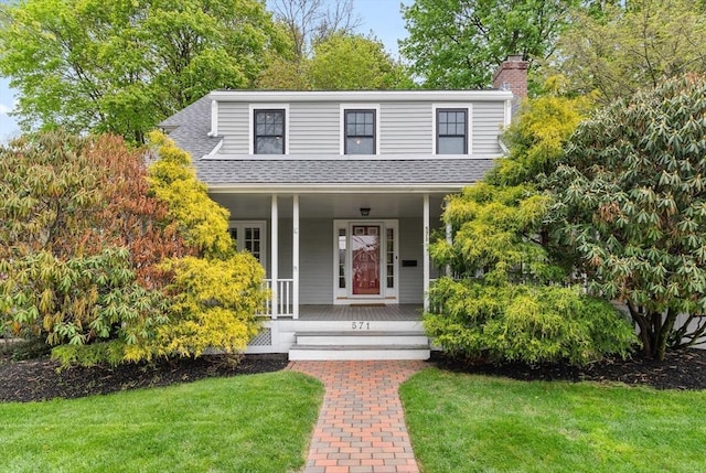 571 Washington St, Winchester, MA 01890 - view of front of home featuring a porch, a front lawn, roof with shingles, and a chimney