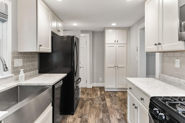 571 Washington St, Winchester, MA 01890 - kitchen with a sink, dark wood-type flooring, black appliances, white cabinets, and recessed lighting