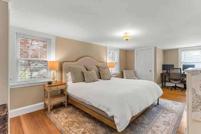 571 Washington St, Winchester, MA 01890 - bedroom with light wood finished floors and baseboards